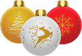 Three large inflatable Christmas ornaments in gold, white and red with gold holiday designs