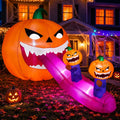 Giant inflatable jack-o'-lantern monster with sharp teeth and a long purple tongue with small pumpkins riding it